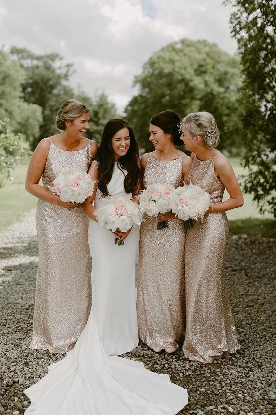 matching silver sequin maxi bridesmaid dresses with high necklines will be great for a formal wedding