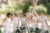mismatching and super elegant white lace bridesmaid dresses with all kinds of designs for a glam boho white wedding