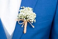 a baby’s breath boutonniere wrapped with twine is a stylish idea for a summer or fall wedding, it will give a rustic feel to the look