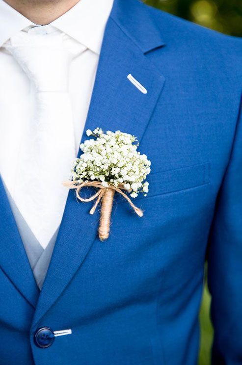 a baby's breath boutonniere wrapped with twine is a stylish idea for a summer or fall wedding, it will give a rustic feel to the look