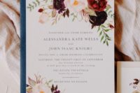 a beautiful fall wedding invitation with bold blooms painted and a blue envelope is a beautiful and refined idea