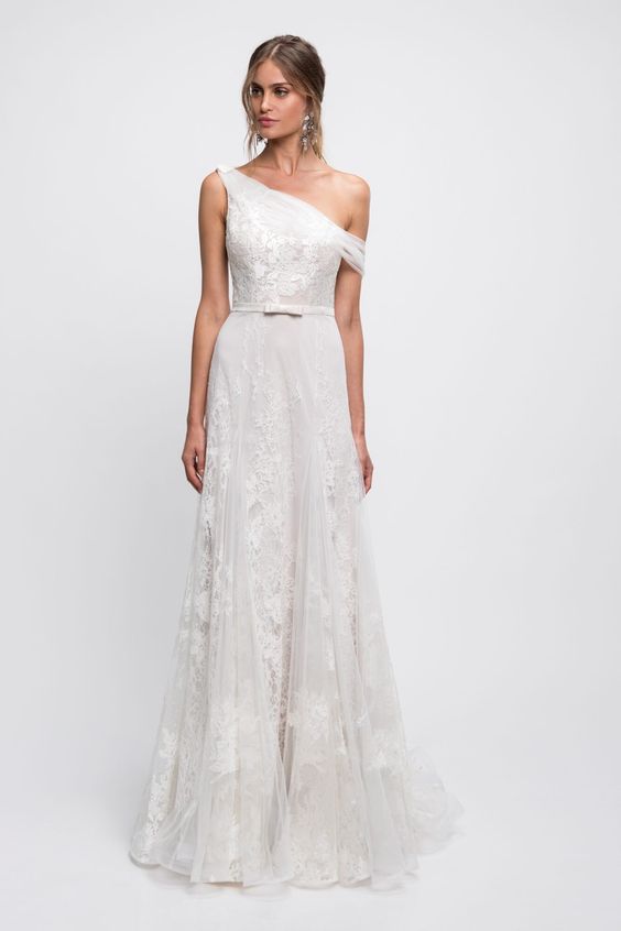 a beautiful lace A-line one shoulder wedding dress with a sash and a bow is a very subtle and romantic idea for a bride
