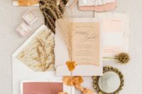 a beautiful pastel and earthy wedding invitation suite in blush, neutrals, beige and ribbons of these colors