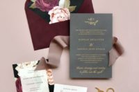 a bold fall wedding invitation suite with a burgundy envelope, bright floral lining and a grey invite plus a ribbon