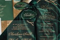 a chic invitation suite of acryl with gold touches and an emerald green envelope plus agates