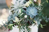 a cool wedding bouquet of greenery, white blooms, succulents and an air plant is an amazing idea for a non-floral wedding