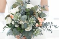 a dimensional wedding bouquet of white roses and peachy ones, eucalyptus and succulents is a lovely and pretty summer idea