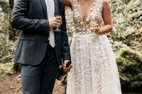 a gorgeous lace applique midi wedding dress with a plunging neckline and no sleeves plus nude shoes