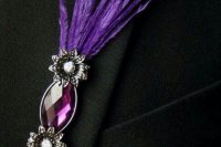 a gorgeous wedding boutonniere of a pink rhinestone, mini flowers and purple feathers will give a creative touch to the look and will add color