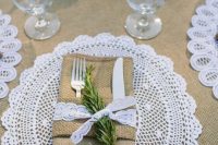 a lace napkin ring with a sprig of herb is a great solution for a rustic or farmhouse wedding