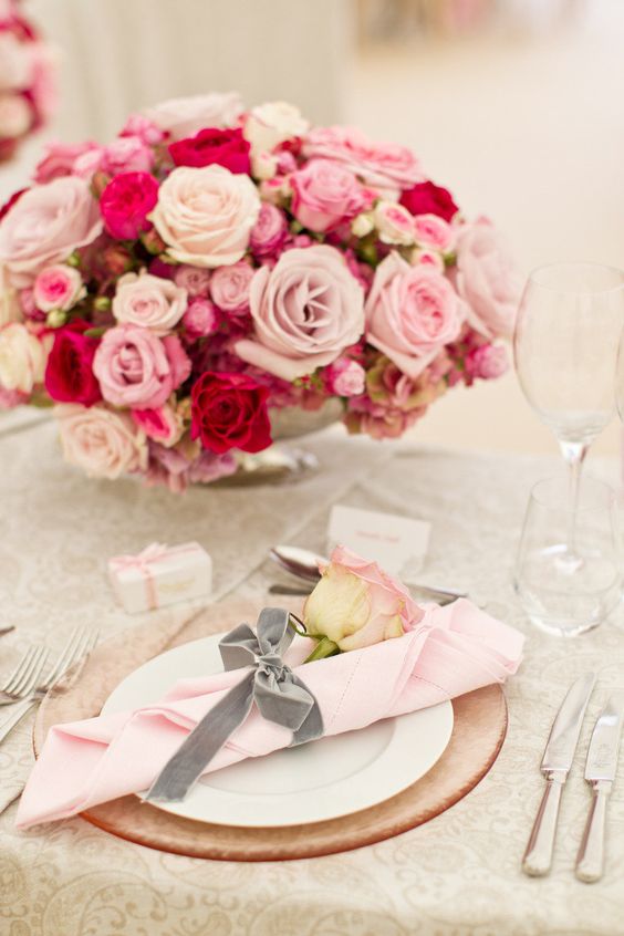 a light pink napkin, a grey velvet ribbon as a napkin ring and a blush rose for a super glam flower filled wedding