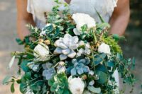 a lovely and vivacious wedding bouquet of white ponies, succulents and greenery is a beautiful solution for any season