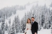 a modern two piece wedding dress with a lace crop top, a plain full skirt with a train for a boho winter wedding