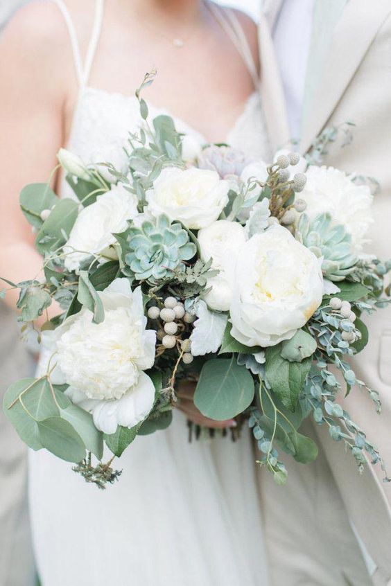 a neutral wedding bouquet of white peonies, succulents and greenery is a stylish idea for a neutral wedding