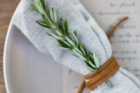 a simple leather cord napkin ring and a herb twig are great for a nature-inspired and laid-back wedding