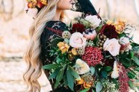 a statement fall wedding bouquet of pink, blush, yellow, burgundy blooms, greenery, seed pods and berries plus cascading blooms is amazing