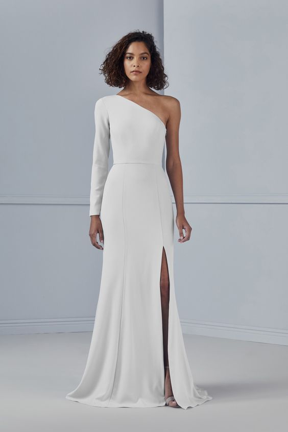 a stylish minimalist one shoulder plain wedding dress with a long sleeve and a thigh high slit, a small train