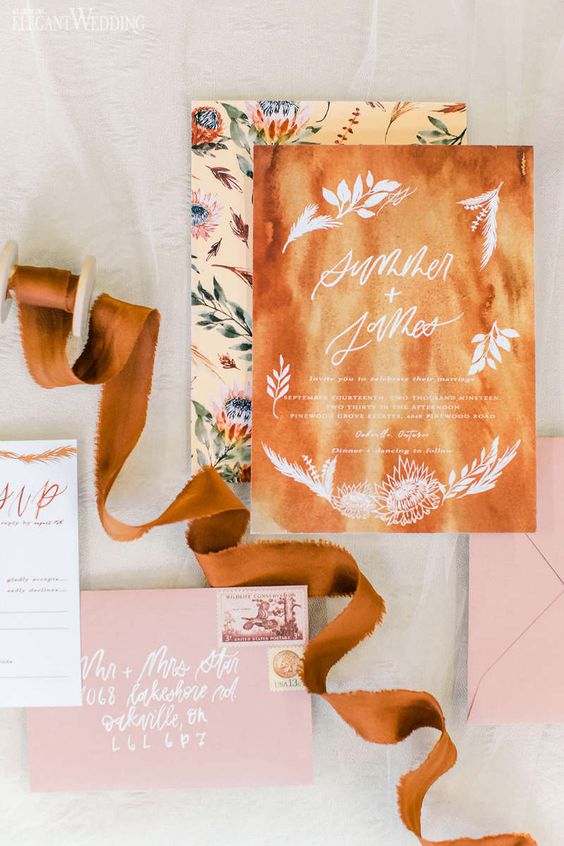 a stylish wedding stationery set in amber, pink and with floral prints is very chic and bright