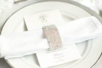 a super glam fully embellished napkin ring is a shiny and glam touch to the tablescape that will give some bling to your table
