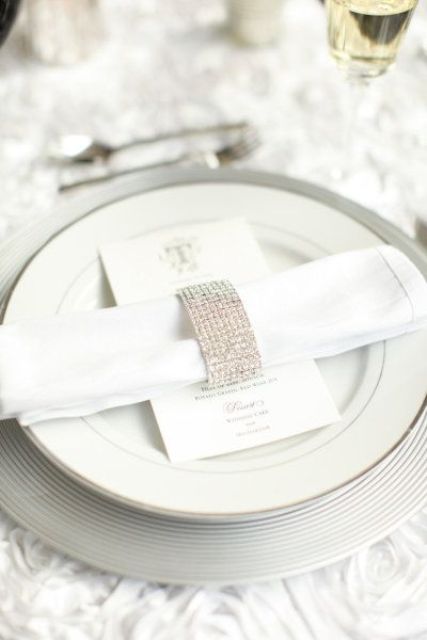 a super glam fully embellished napkin ring is a shiny and glam touch to the tablescape that will give some bling to your table