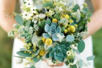 a textural and dimensional wedding bouquet of greenery, succulents, white blooms and billy balls is a catchy and bold idea