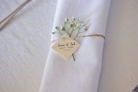 a twine napkin ring with baby’s breath and a little name tag instead of a palce card is a very chic and lovely idea