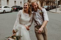 a two piece elopement wedding dress with a boho lace crop top with long shoulders, a tulle layered skirt for a boho feel