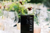a very modern black and white table number will fit any floral arrangement or a greenery one
