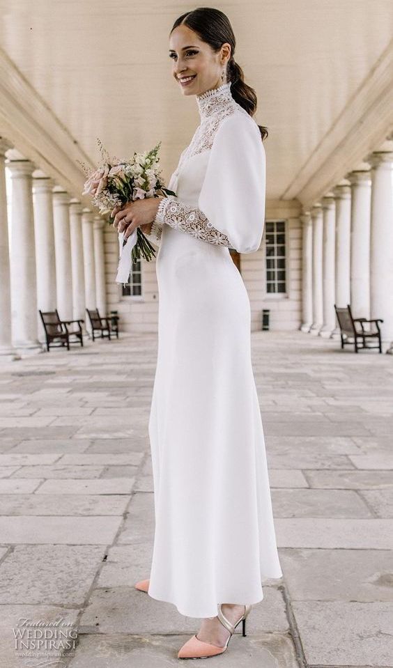 a vintage-inspired plain midi wedding dress with a lace turtleneck, puff and boho lace sleeves, peachy and gold shoes for a touch of color