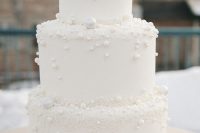 a white pearl wedding cake with mini beads is a gorgeous idea for a modern glam wedding