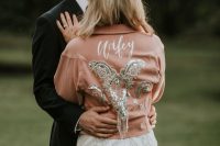 an amber embellished and embroidered bridal jacket with long sleeves is a bold accessory