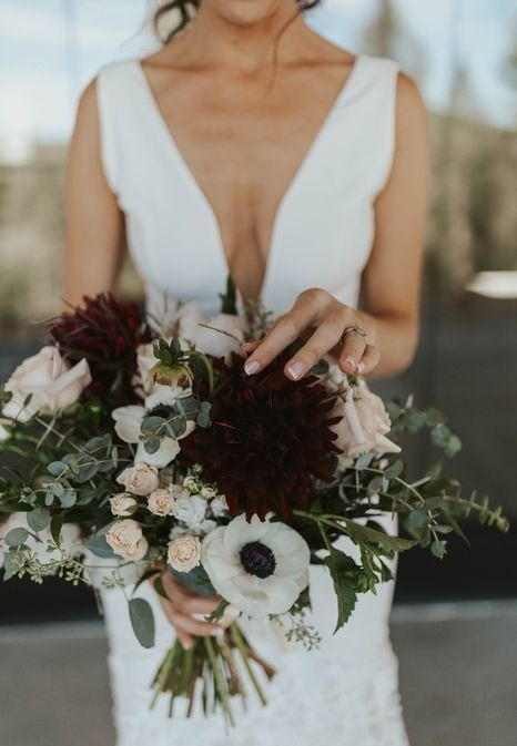 an elegant moody fall wedding bouquet of white, blush, burgundy blooms, greenery is a stylish idea to rock in the fall