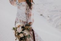 an off the shoulder floral wedding dress with puff sleeves is amazing for a boho elopement anywhere