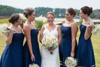 chic and elegant strapless navy and clear A-lien bridesmaid dresses, statement necklaces and nude shoes for a bold summer wedding