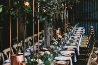 copper goblets, tall copper centerpieces and copper candleholders, greenery and neutral linens