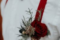 deep red suspenders and a deep red boutonniere will accent a fall groom’s look easily