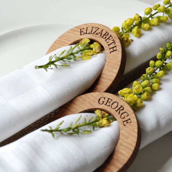 handmade solid oak, personalised napkin rings that will make any table setting look divine, refrehs them with natural blooms of some bright shade