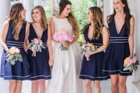 navy and white thin stripe A-line knee bridesmaid dresses with thick straps and plunging necklines, nude shoes and pink wedding bouquets