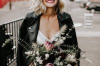 a black leather moto jacket is a bold and edgy idea to cover up for a fall wedding
