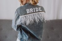 a blue denim jacket with long white fringe is a great idea for a slight boho touch to your look