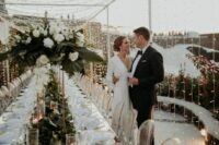 a canopy of string lights and glasses with floating candles are great to make your wedding reception look wow
