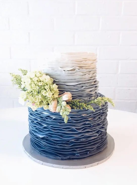 a chic ombre blue wedding cake decorated with real blooms and greenery is a lovely solution for a vintage-inspired wedding