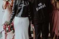 a customized black leather jacket will contrast your neutral wedding dress and make your look edgy