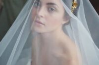 a gorgeous gold flower bridal tiara paired with a cathedral veil is a beautiful idea for any bride, it will add a chic and refined touch to the look