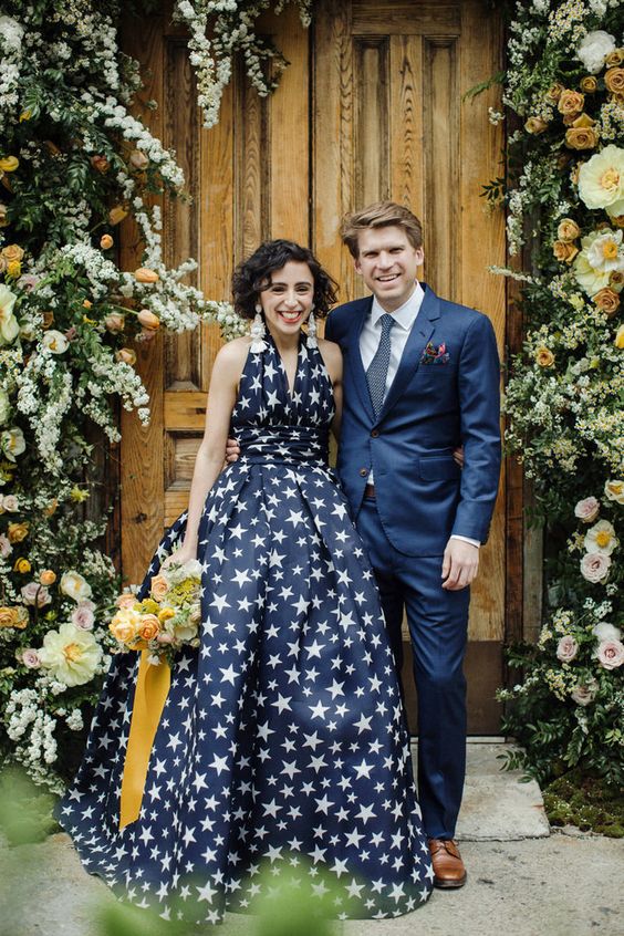 a midnight blue star print wedding dress with thick straps and no sleeves looks very chic