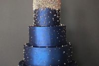 a midnight blue wedding cake decorated with sparkling edible beads looks very bold and statement-like