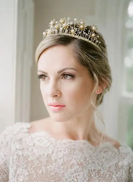 a refined bridal tiara with rhinestones and pearls for a queen-like look