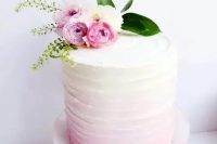 a soft ombre pink wedding cake with a texture and baby roses on top will perfectly fit a spring or summer wedding