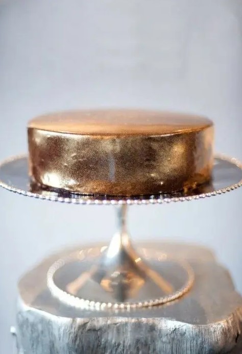 an elegant gold leaf one tier wedding cake is amazing for a modern or minimalist wedding