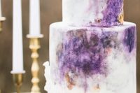 an inspiring ombre watercolor purple wedidng cake with gold touches is a lovely idea for a refined modern wedding